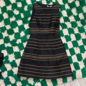 Black mini dress with gold stripes